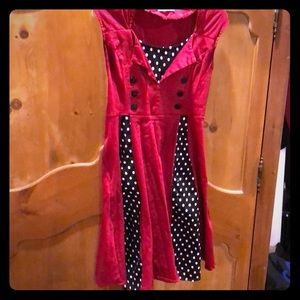 Red and black and white polka dot accents.